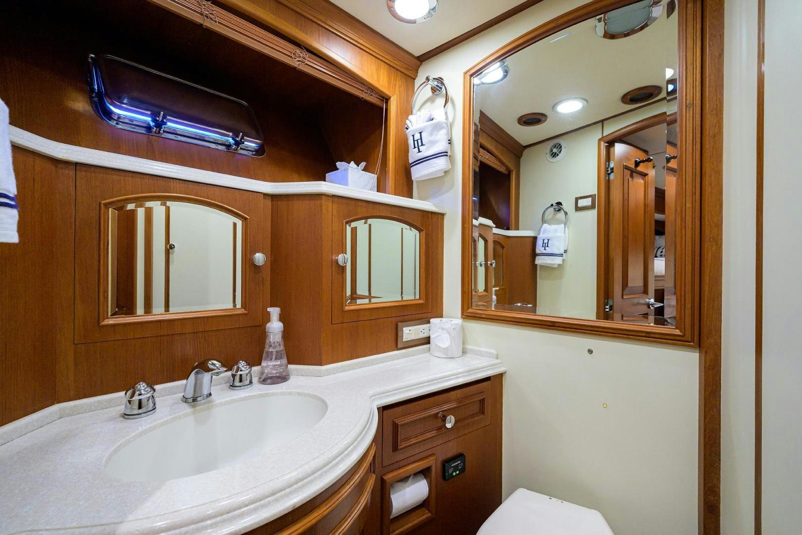 a bathroom with a large mirror aboard HARD TIMES NAME RESERVED Yacht for Sale