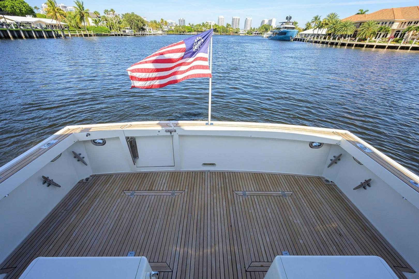 a boat with a flag on it aboard HARD TIMES NAME RESERVED Yacht for Sale