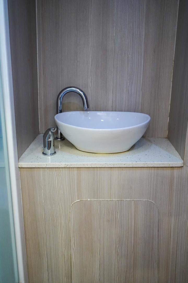 a white bowl on a counter aboard BIG ENOS Yacht for Sale