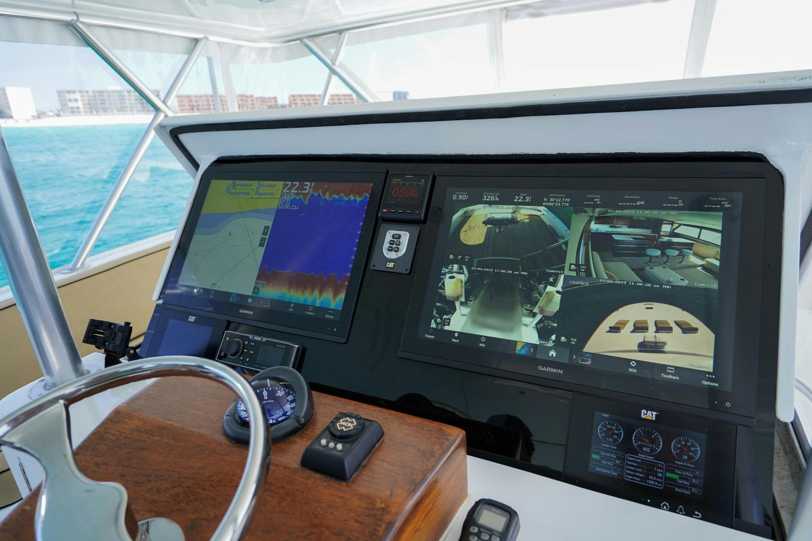 a group of monitors on a table aboard BIG ENOS Yacht for Sale
