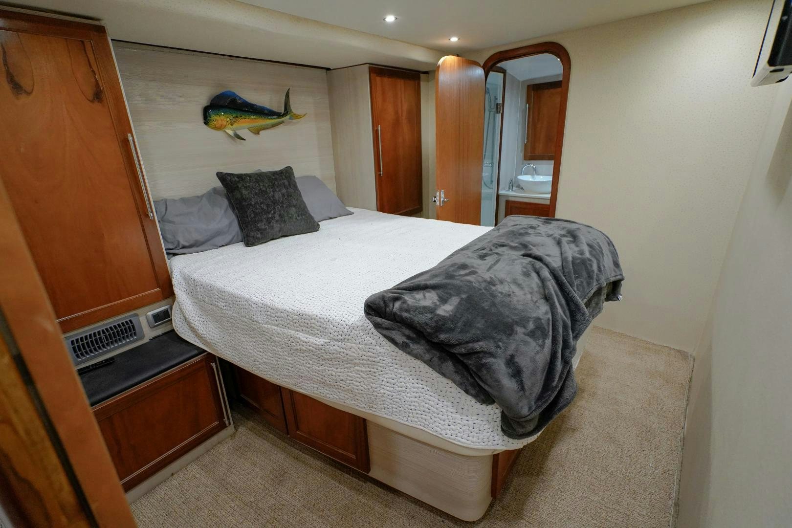 a bed with a white sheet aboard BIG ENOS Yacht for Sale