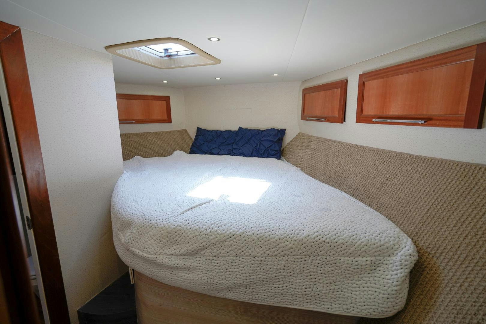 a bedroom with a bed aboard BIG ENOS Yacht for Sale