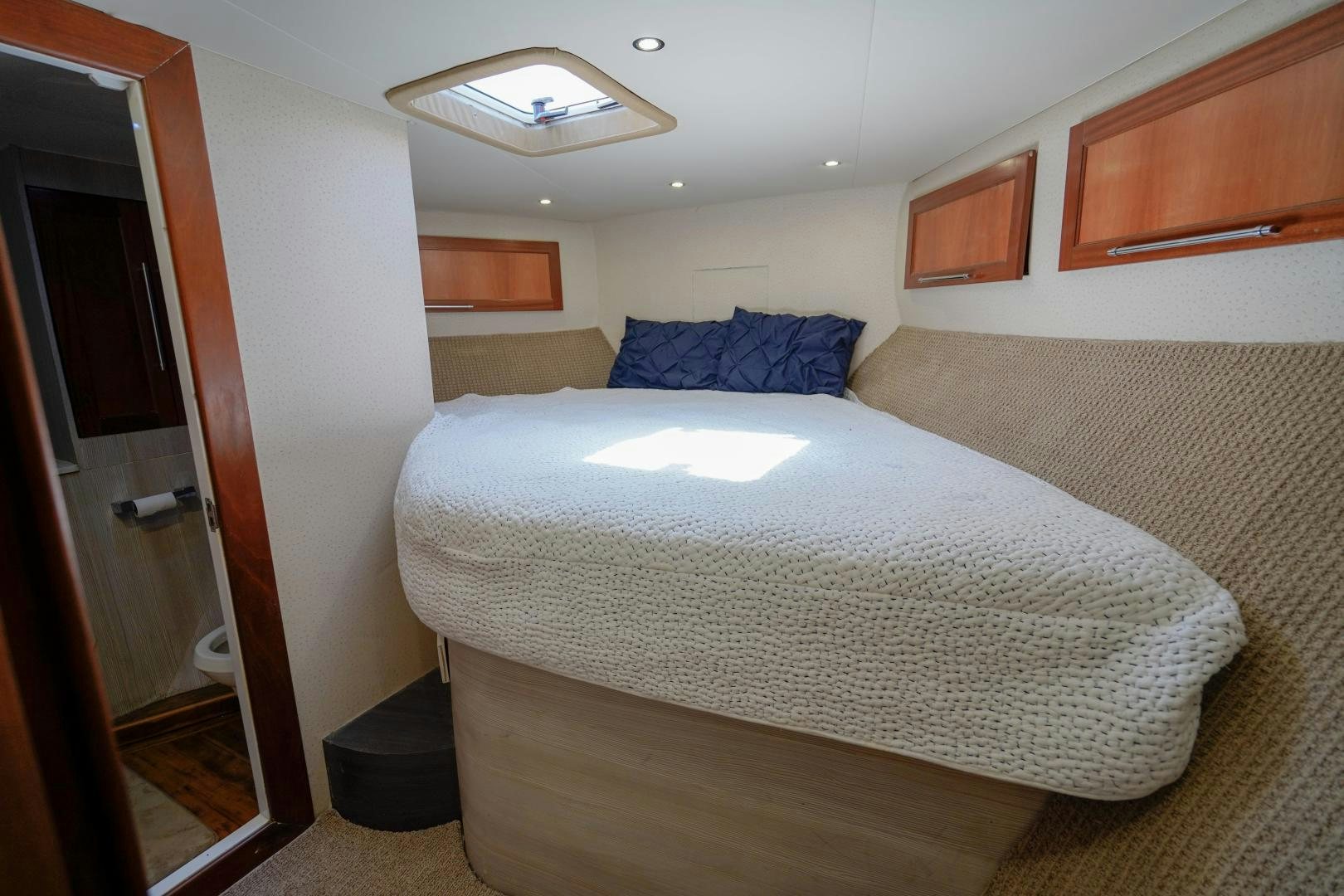 a bed in a room aboard BIG ENOS Yacht for Sale