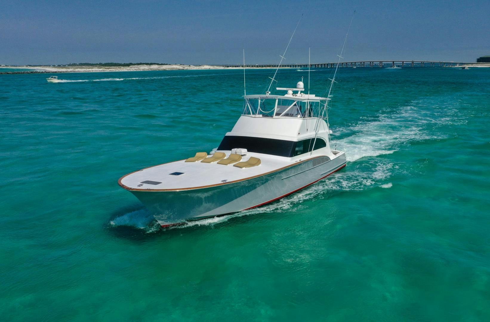 a small white boat in the water aboard BIG ENOS Yacht for Sale