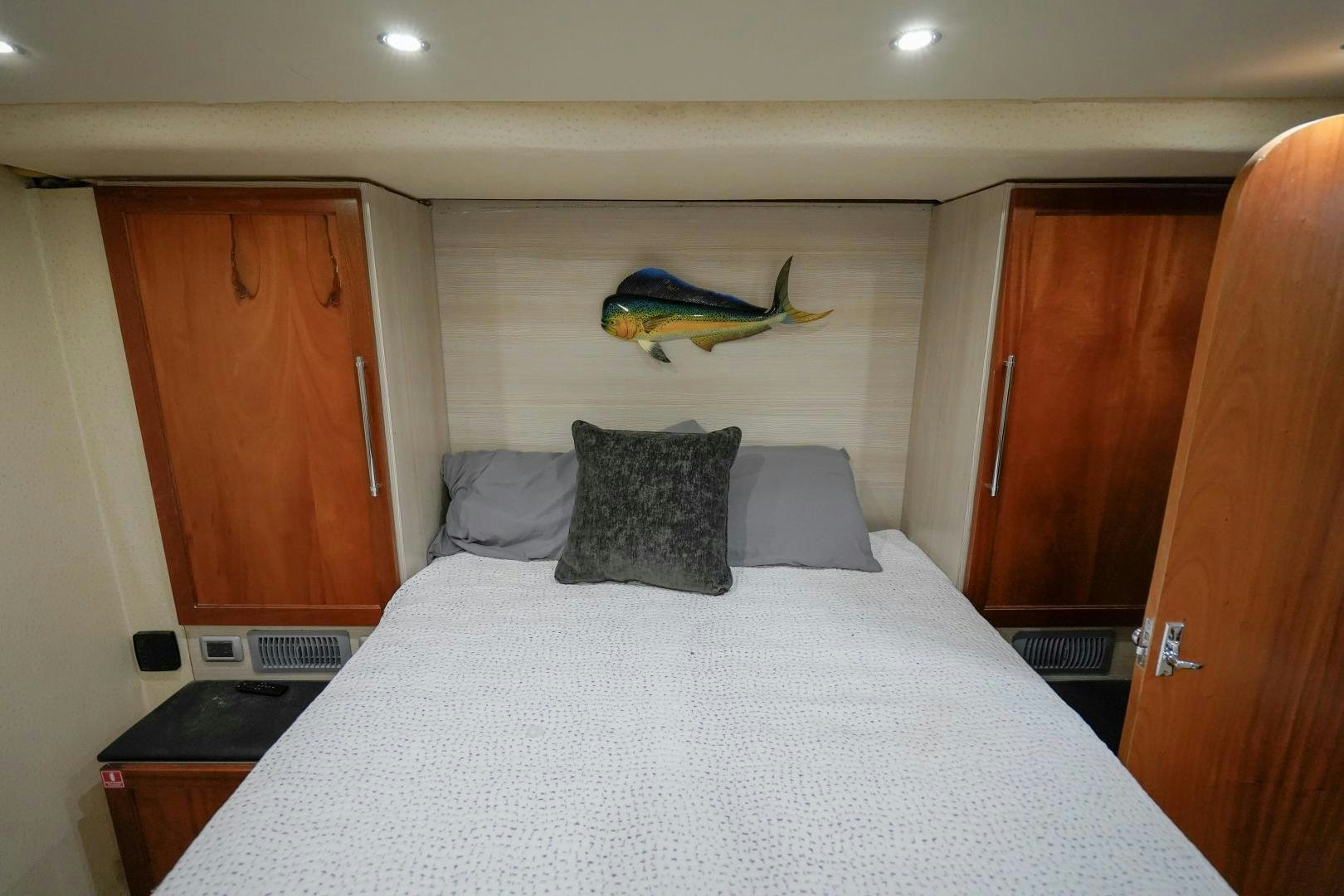 a bed in a room aboard BIG ENOS Yacht for Sale
