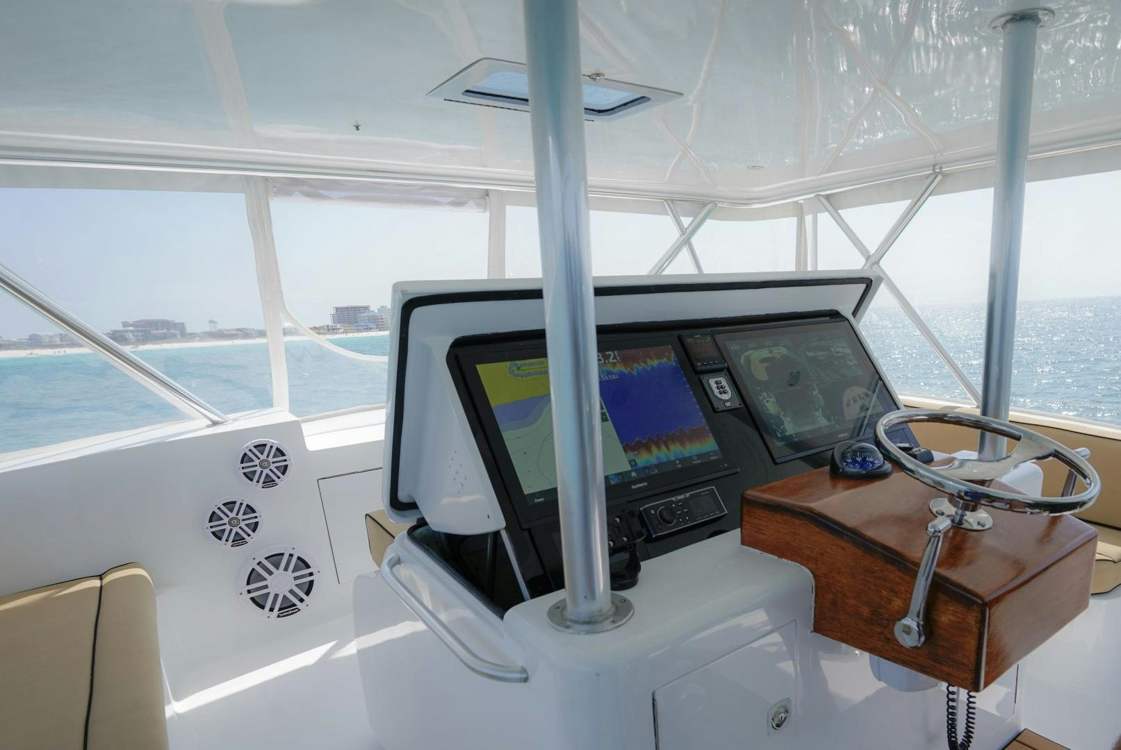 a boat with a computer monitor and a desk with a computer on it aboard BIG ENOS Yacht for Sale