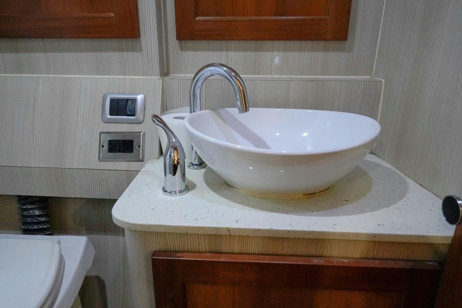 a sink with a faucet aboard BIG ENOS Yacht for Sale