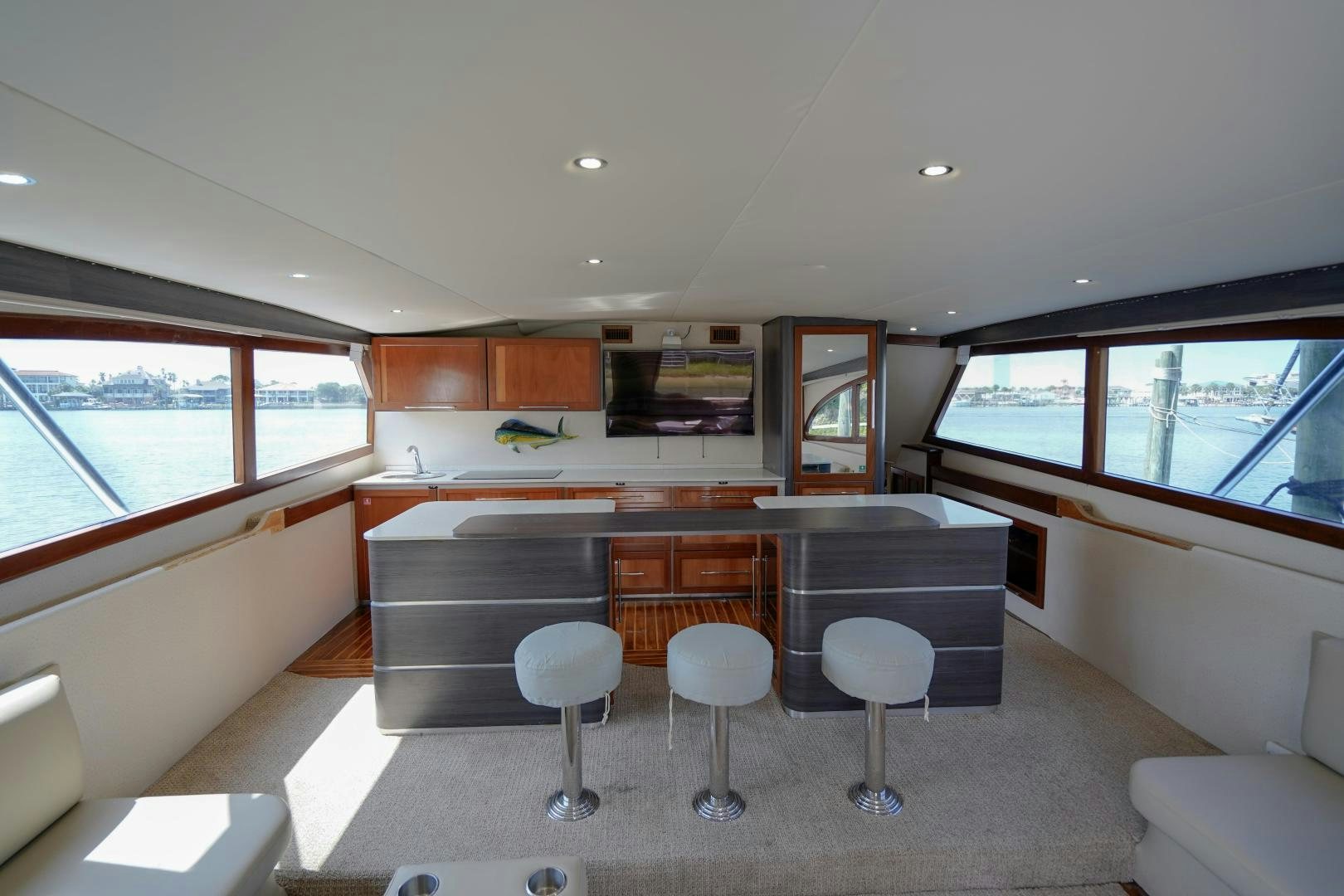 a room with a table chairs and a large window aboard BIG ENOS Yacht for Sale