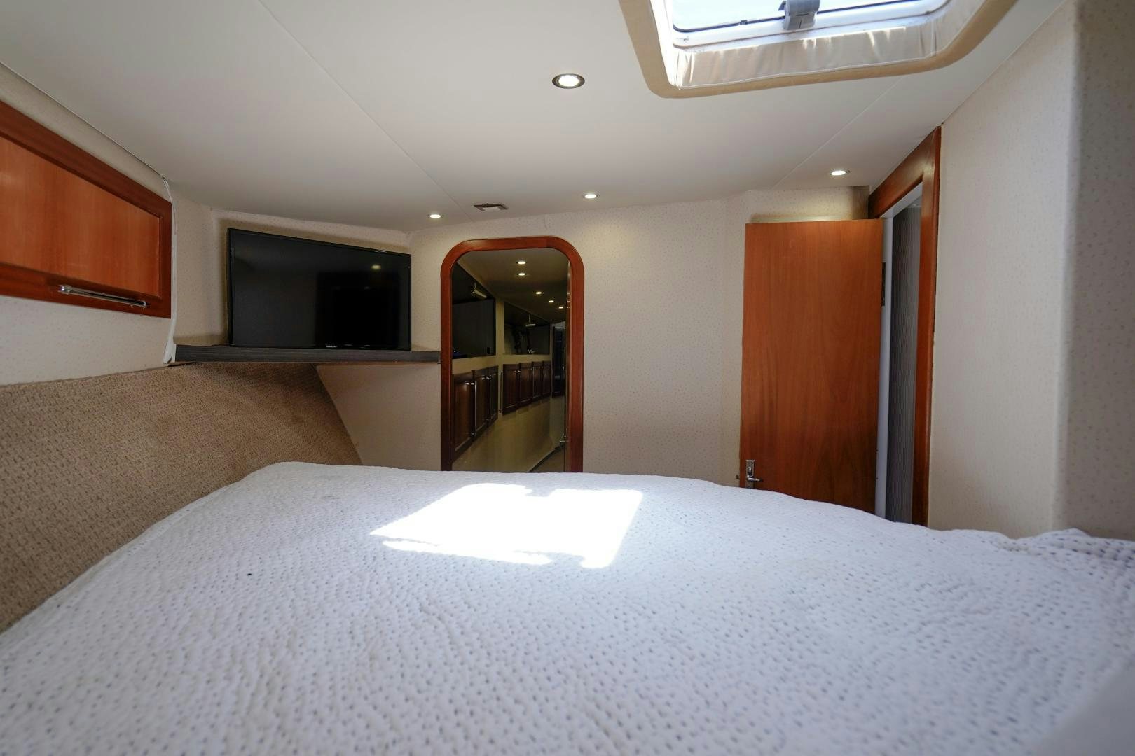 a bed in a room aboard BIG ENOS Yacht for Sale