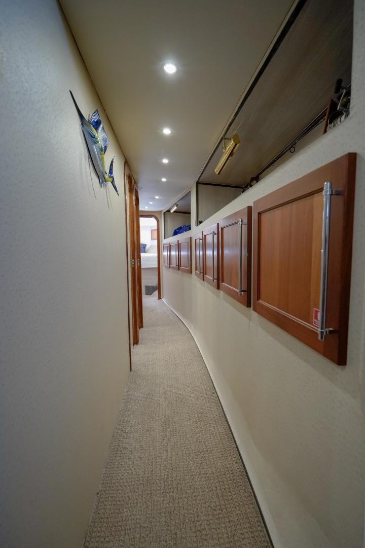 a hallway with several doors aboard BIG ENOS Yacht for Sale