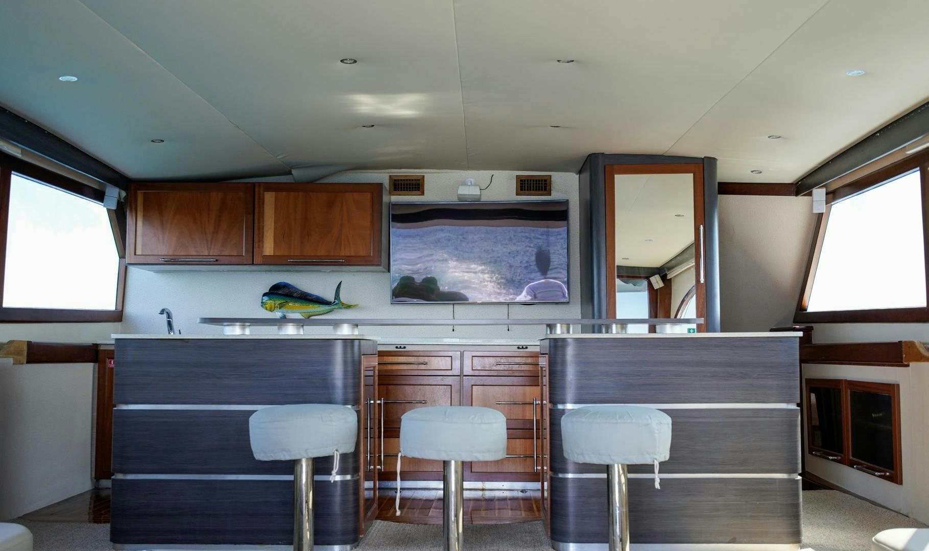a kitchen with a large window aboard BIG ENOS Yacht for Sale