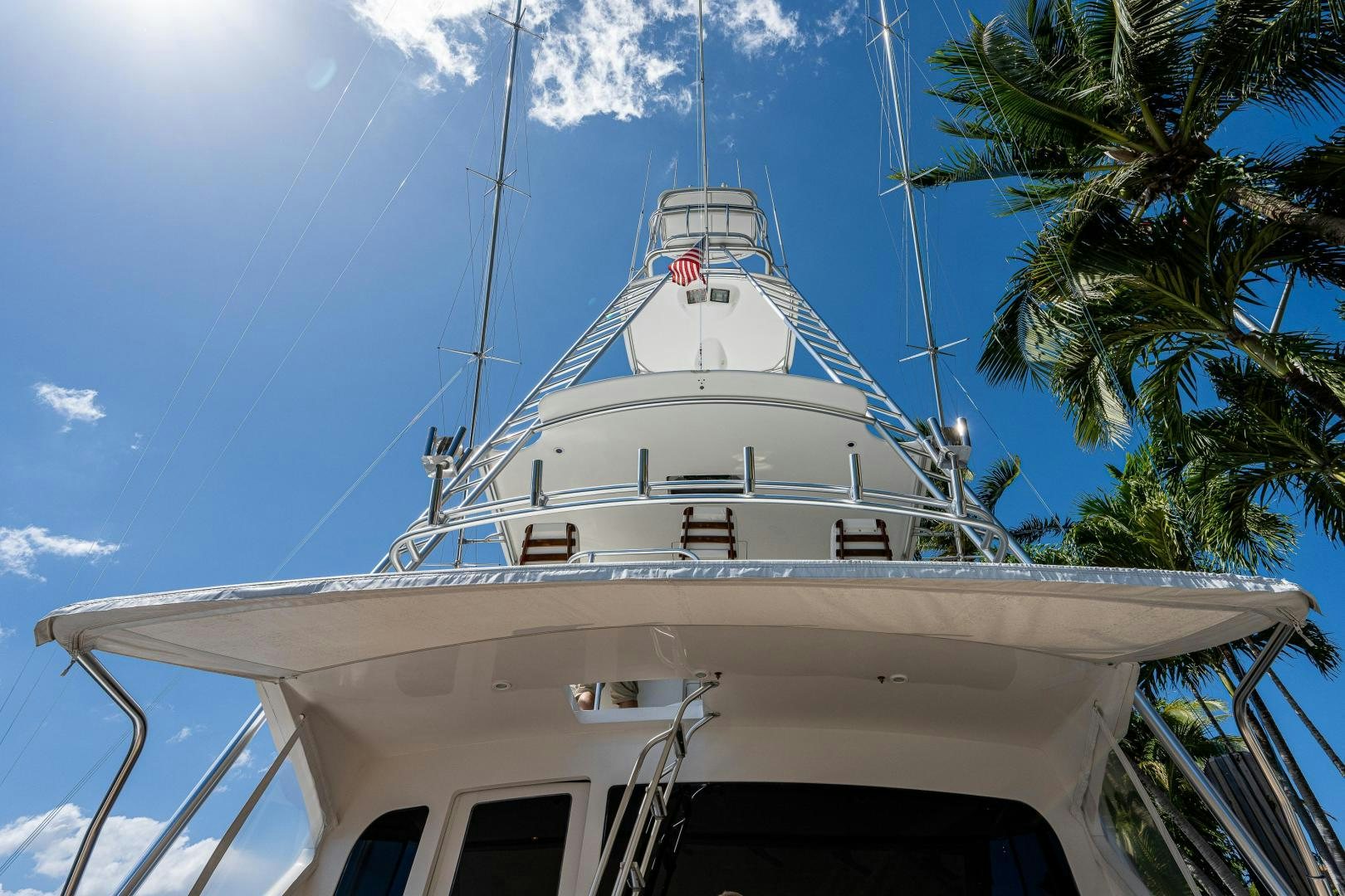 a white boat with blue sky aboard REEL ESTATE Yacht for Sale