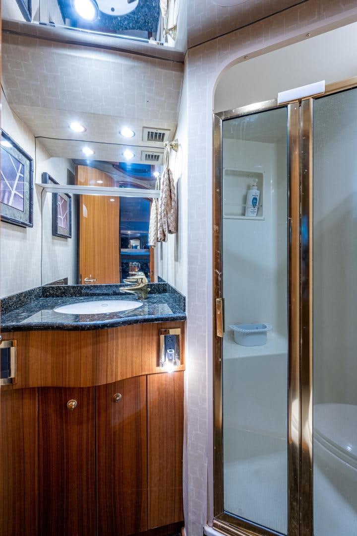 a bathroom with a sink and a mirror aboard REEL ESTATE Yacht for Sale