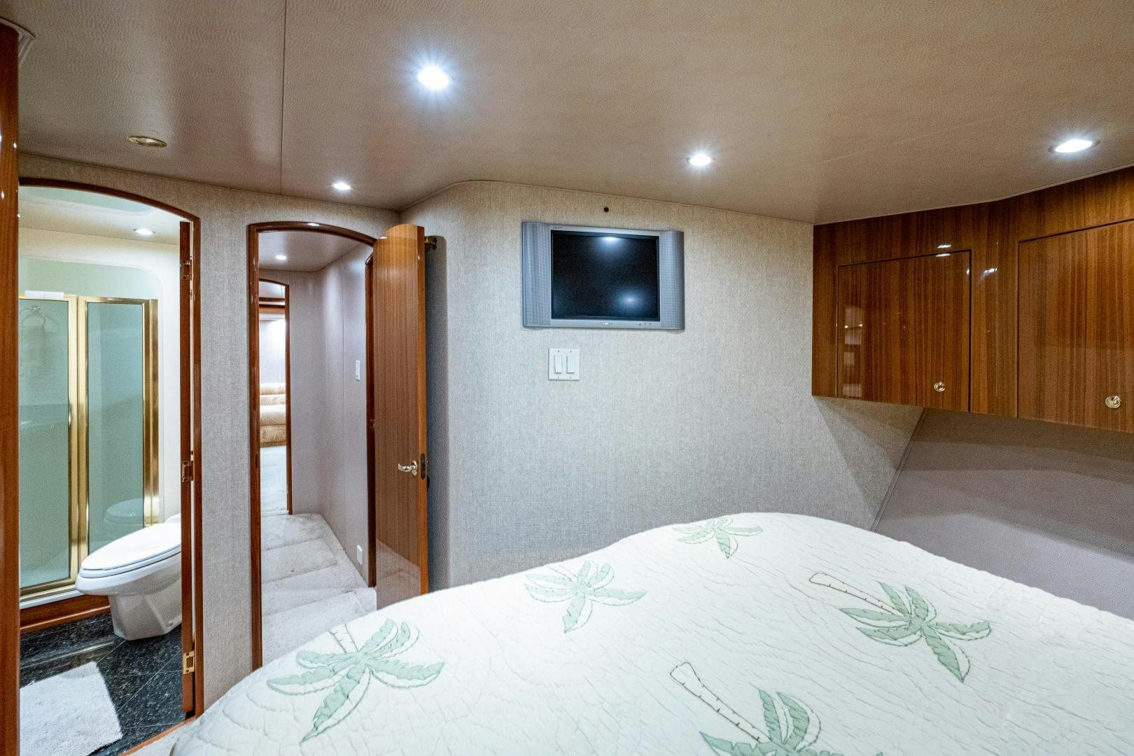 a bedroom with a large bed aboard REEL ESTATE Yacht for Sale