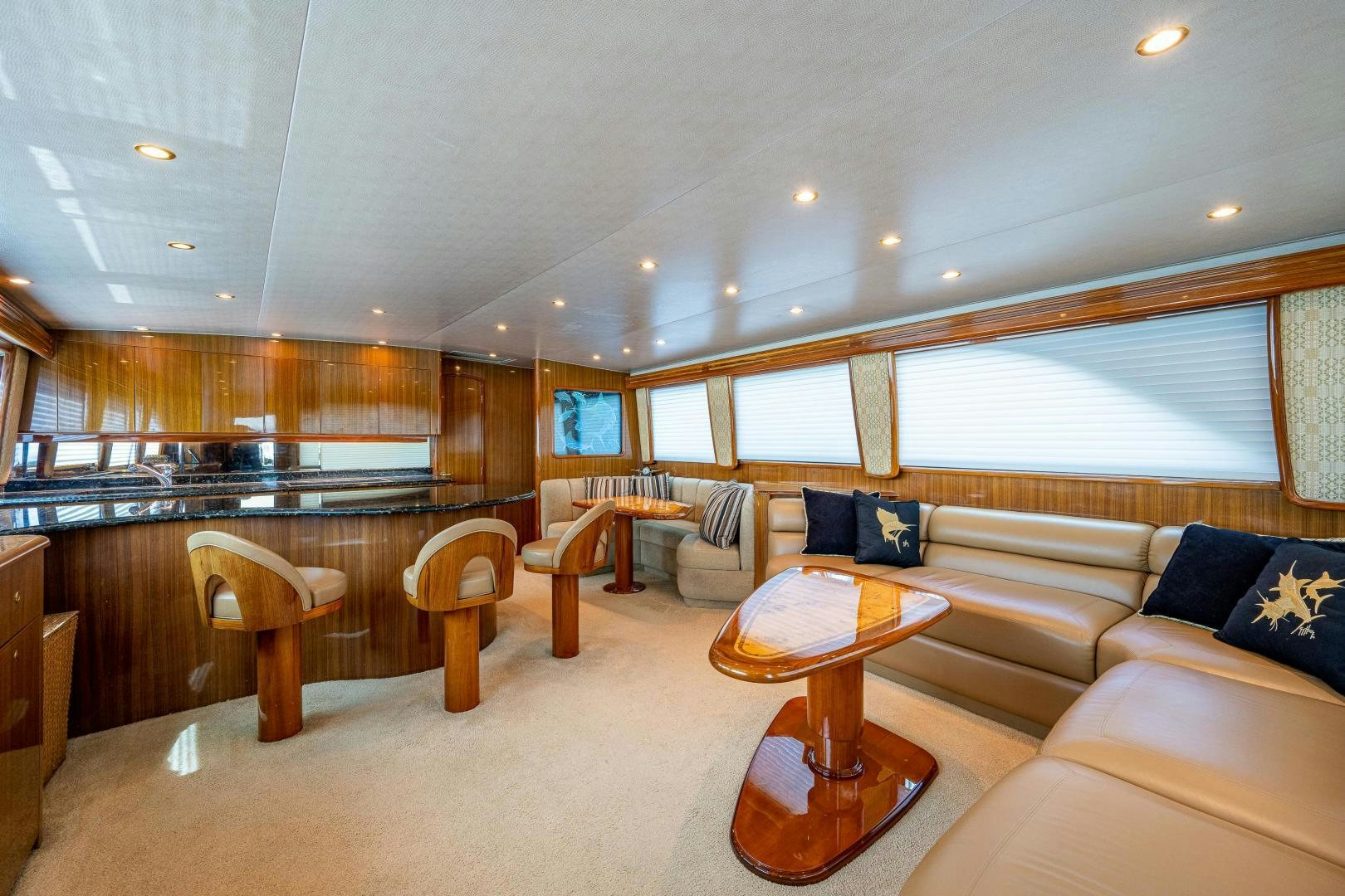 a living room with a couch and a table aboard REEL ESTATE Yacht for Sale