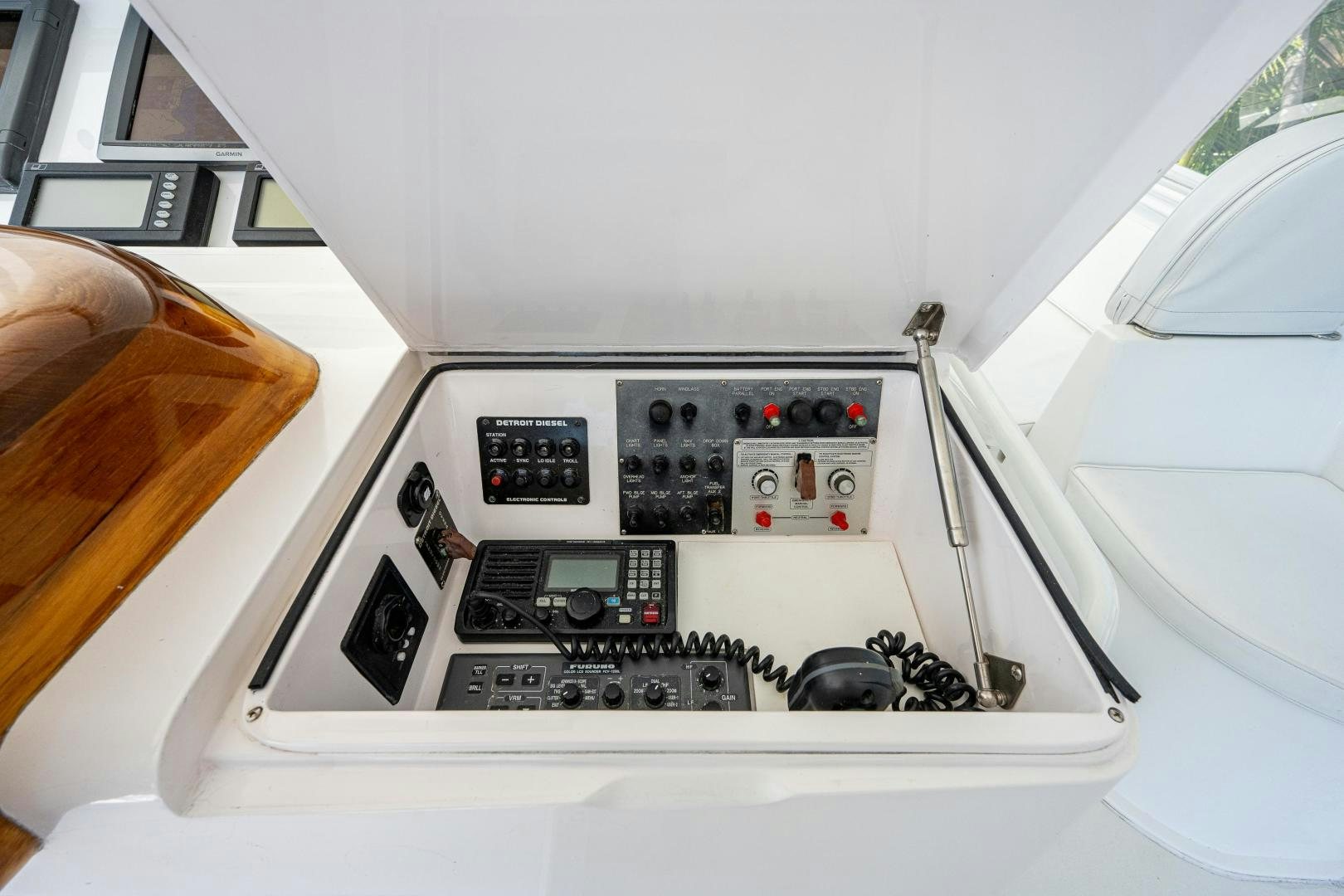a white car with a black control panel aboard REEL ESTATE Yacht for Sale