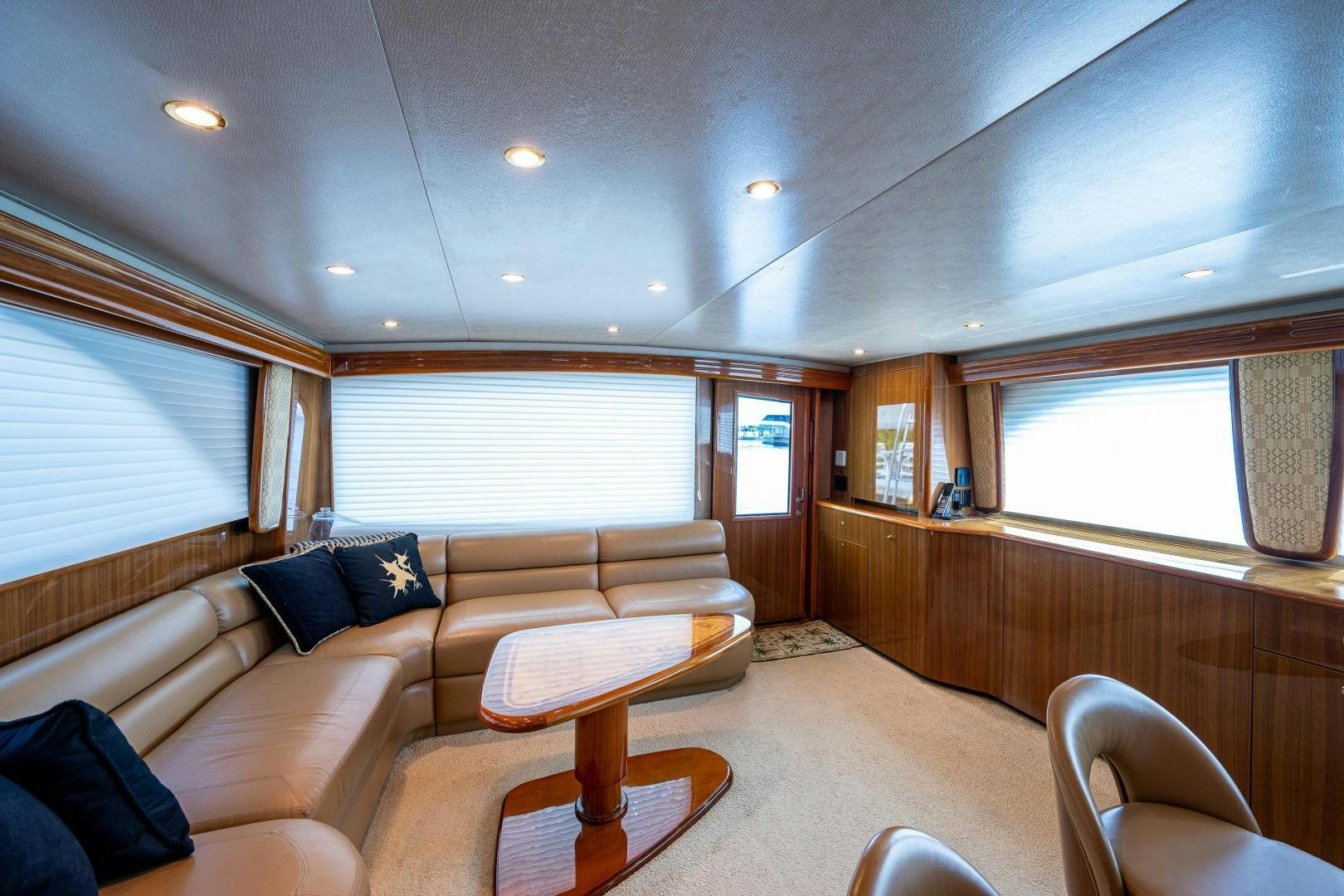a living room with a couch and a table aboard REEL ESTATE Yacht for Sale