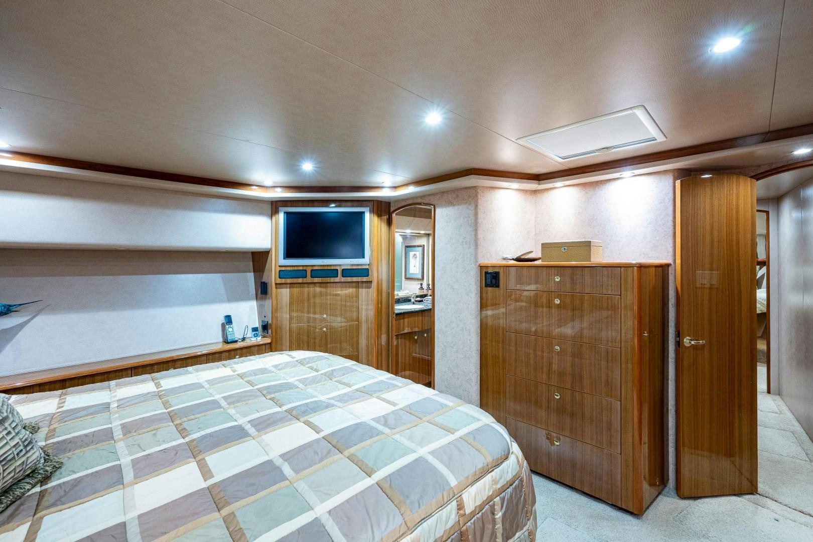 a room with a bed and a tv aboard REEL ESTATE Yacht for Sale