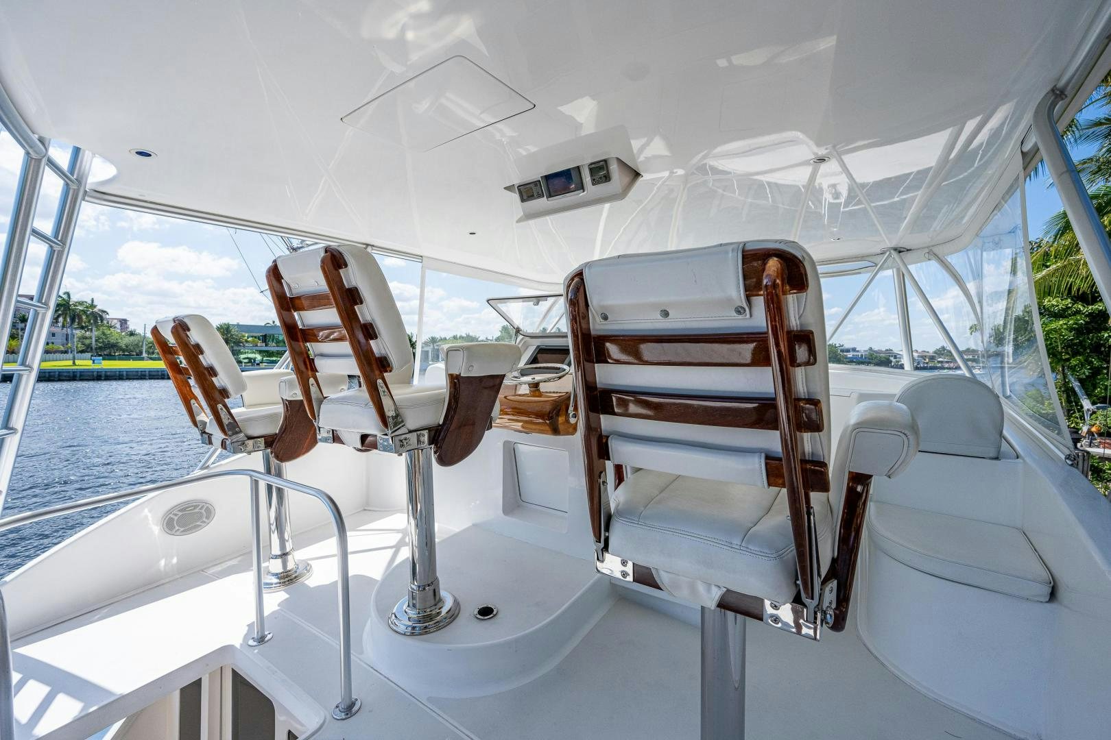 a boat with chairs on the deck aboard REEL ESTATE Yacht for Sale
