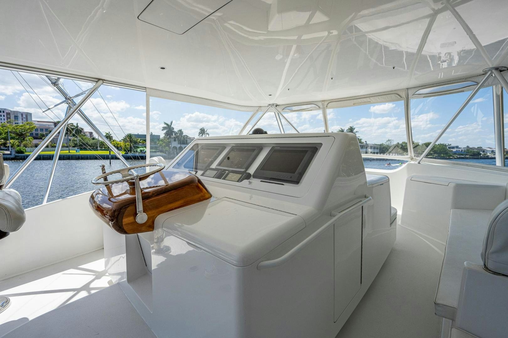 a white boat with a brown object on it aboard REEL ESTATE Yacht for Sale