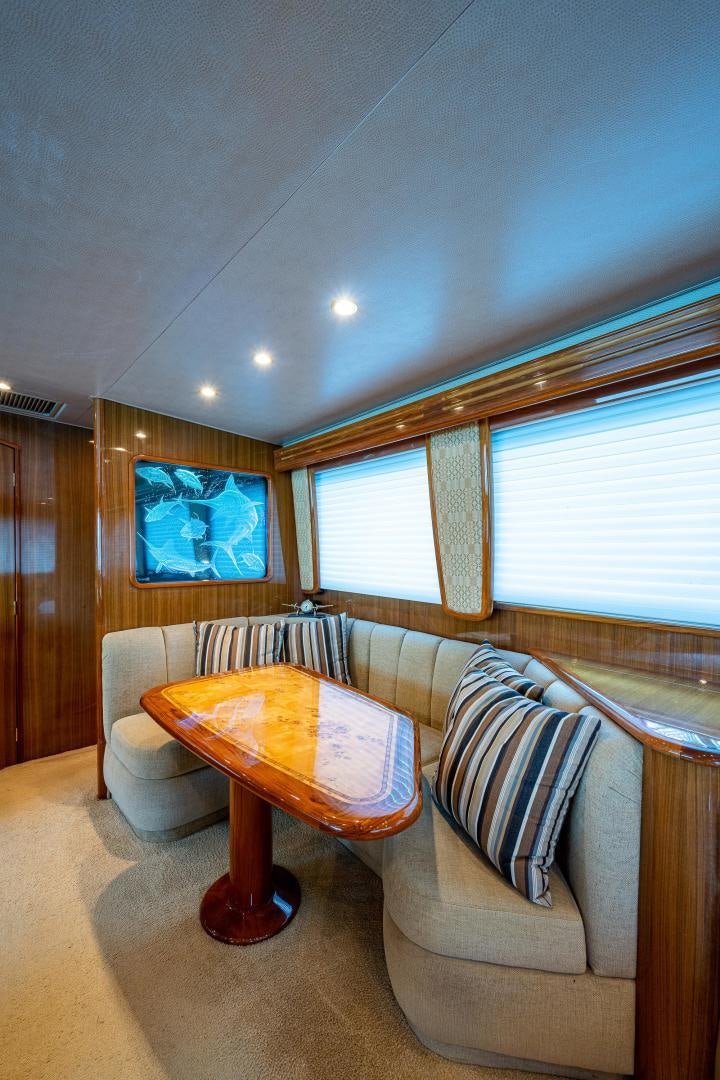 a living room with a couch and a table aboard REEL ESTATE Yacht for Sale