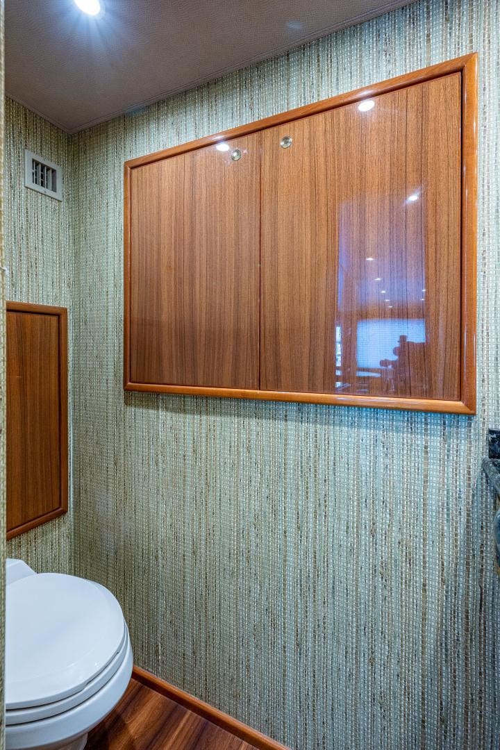 a bathroom with a mirror aboard REEL ESTATE Yacht for Sale