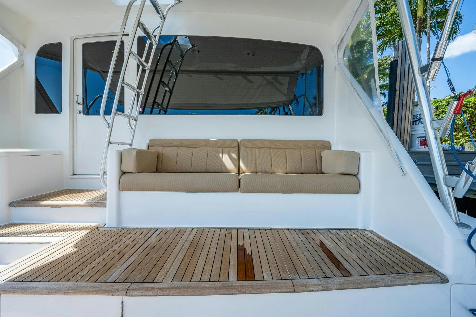 a white couch in a vehicle aboard REEL ESTATE Yacht for Sale