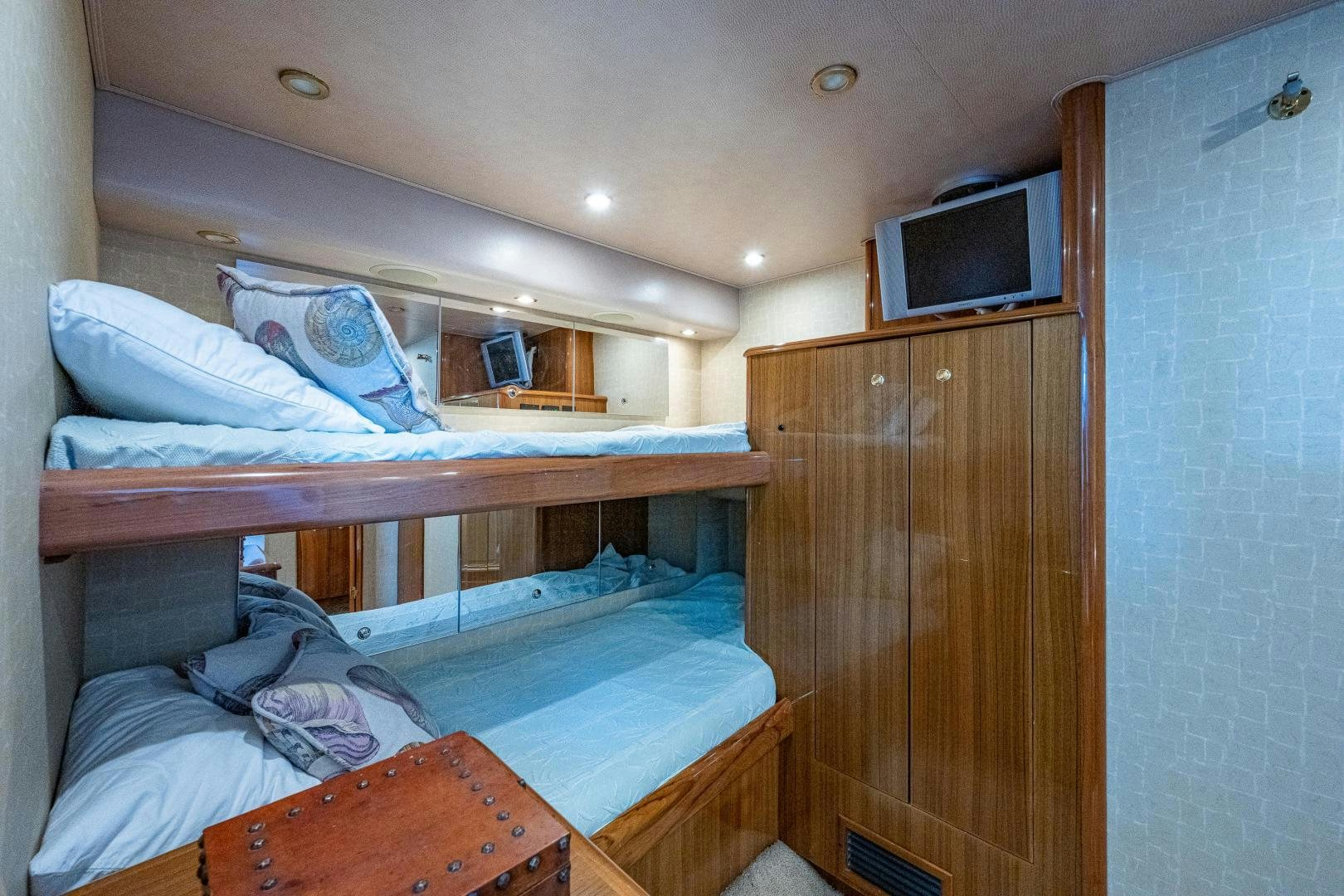 a room with bunk beds aboard REEL ESTATE Yacht for Sale