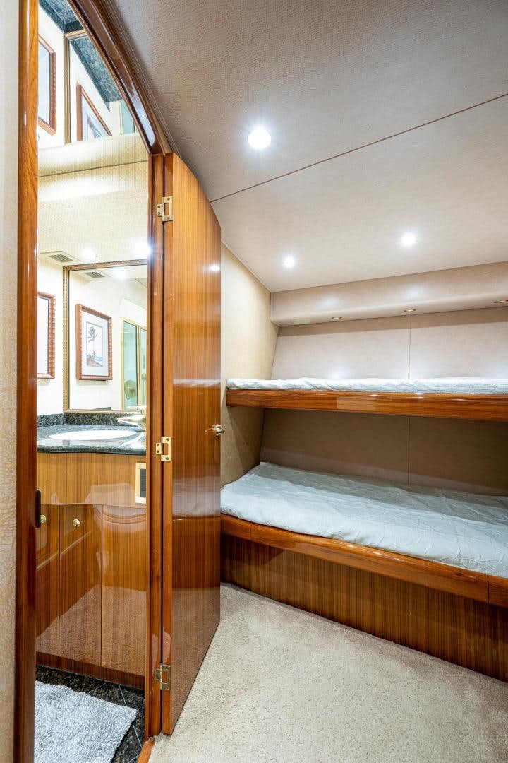 a room with a bed and a closet aboard REEL ESTATE Yacht for Sale