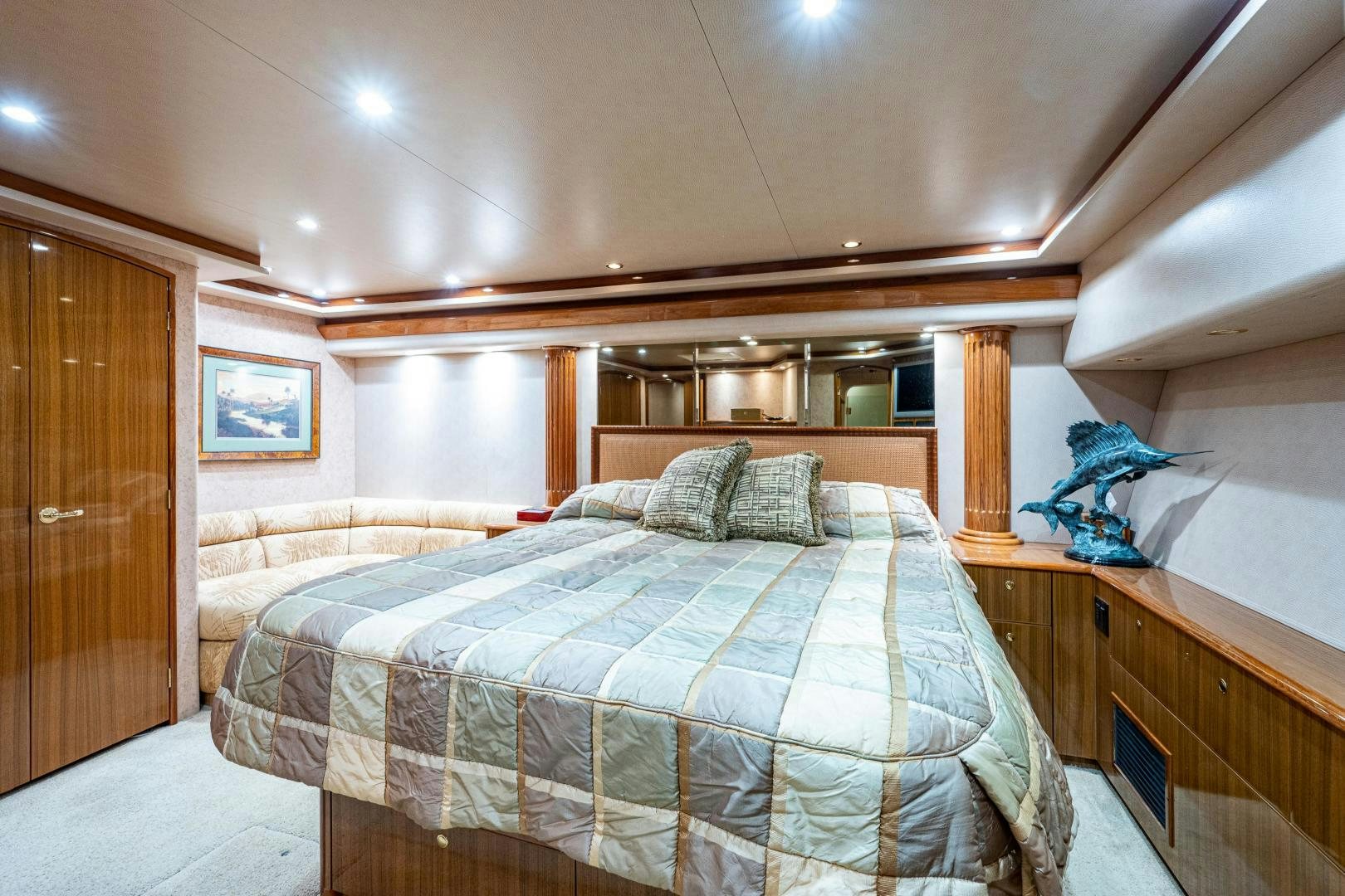 a bedroom with a bed and a closet aboard REEL ESTATE Yacht for Sale