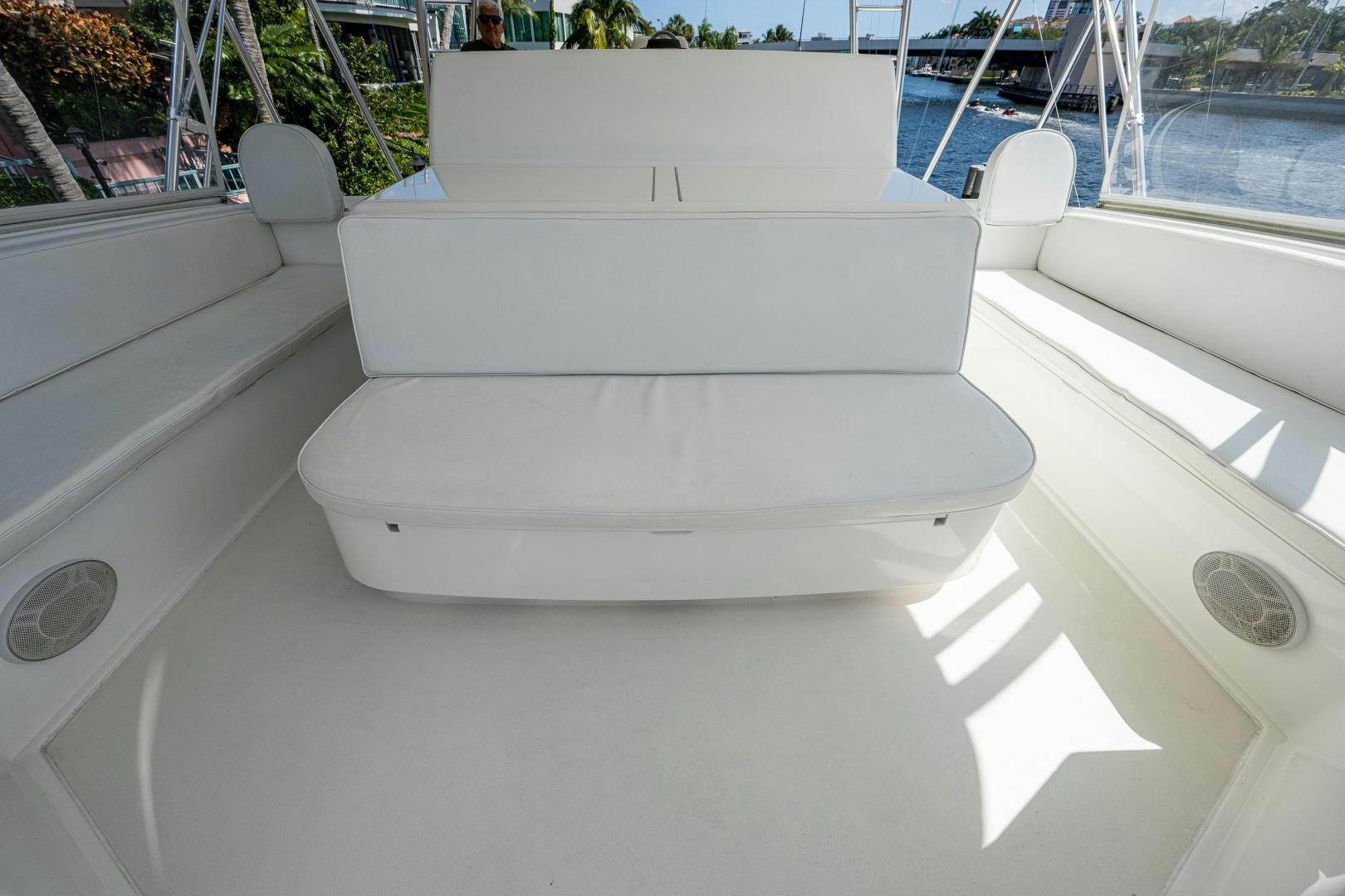 a white couch on a balcony aboard REEL ESTATE Yacht for Sale