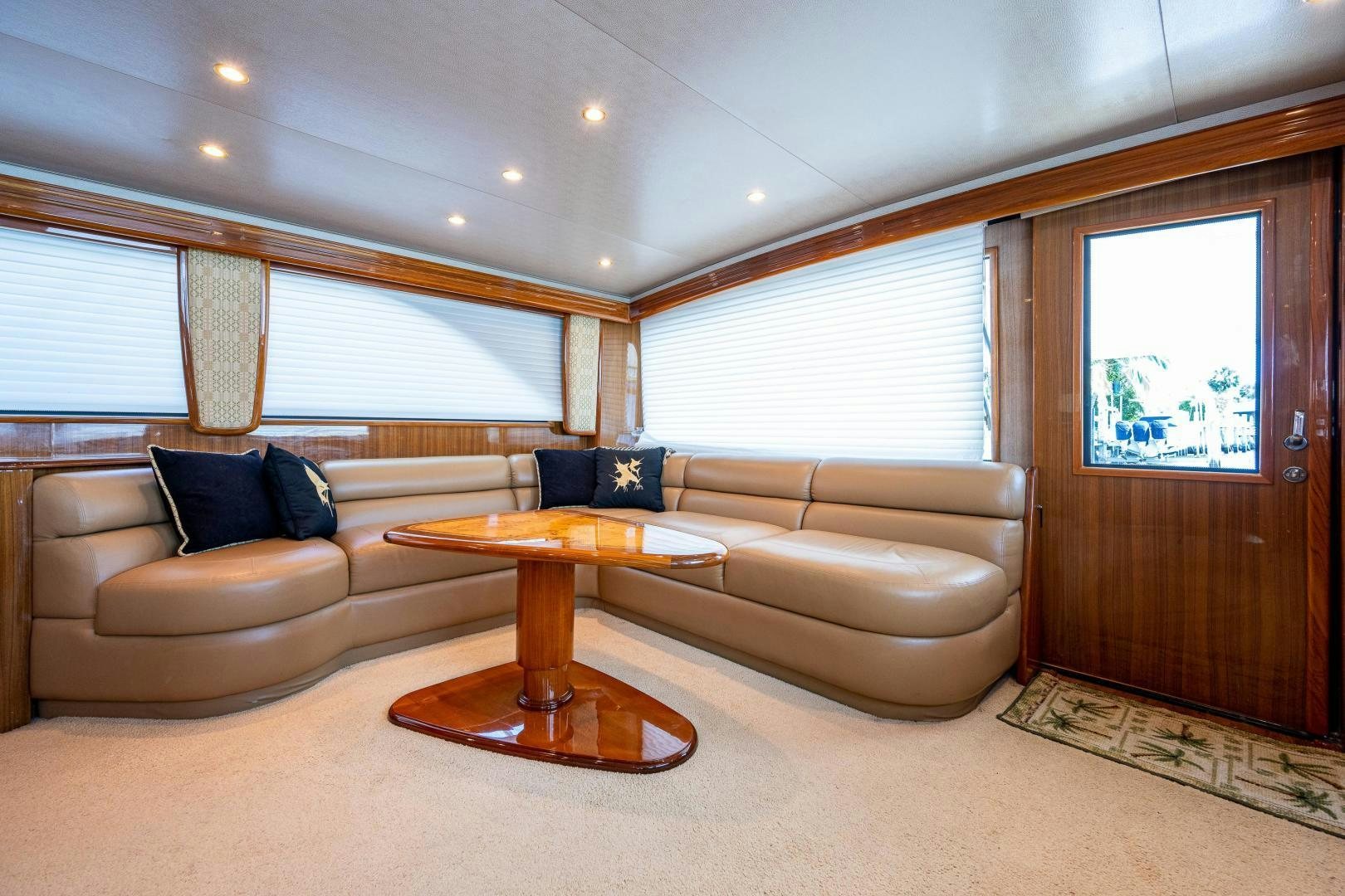 a living room with a couch and a coffee table aboard REEL ESTATE Yacht for Sale