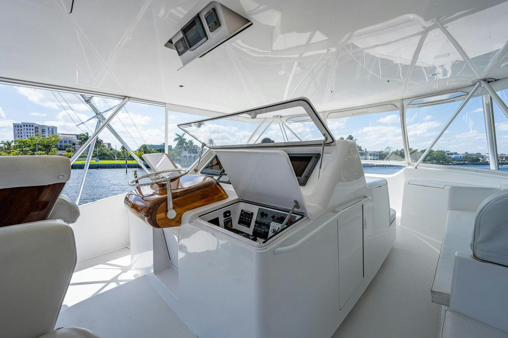inside of a white car aboard REEL ESTATE Yacht for Sale