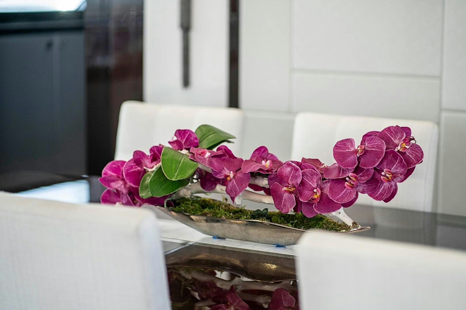 a vase with pink flowers aboard QUANTUM Yacht for Sale
