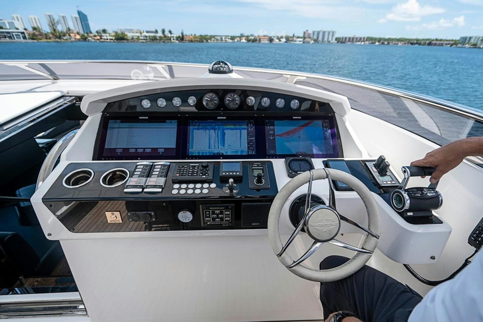 a person driving a car aboard QUANTUM Yacht for Sale