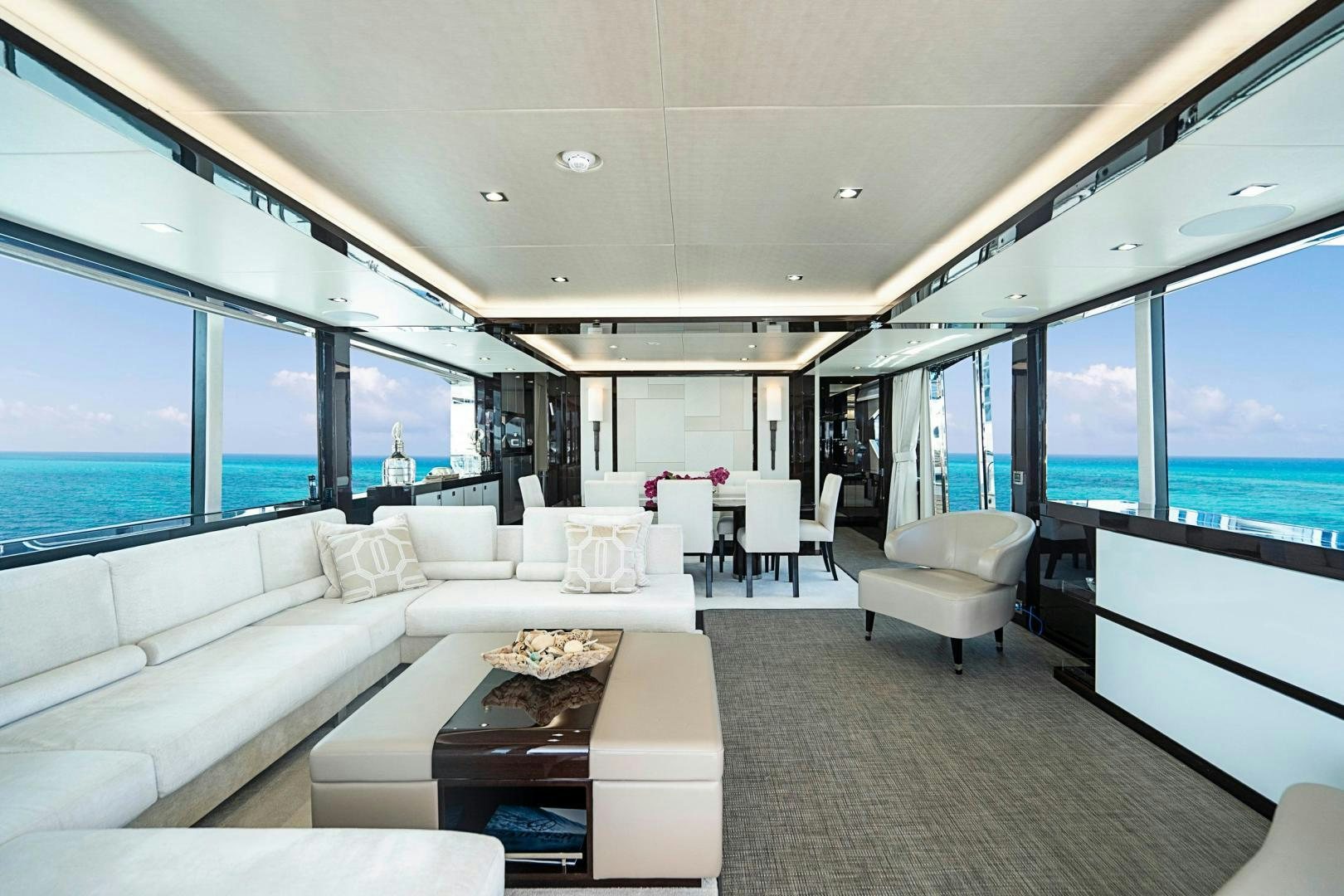 a living room with a large window aboard QUANTUM Yacht for Sale