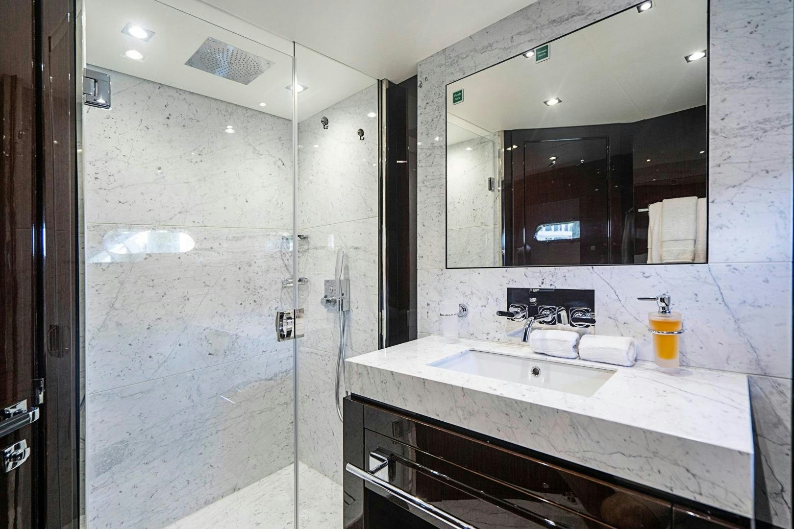 a bathroom with a large mirror aboard QUANTUM Yacht for Sale