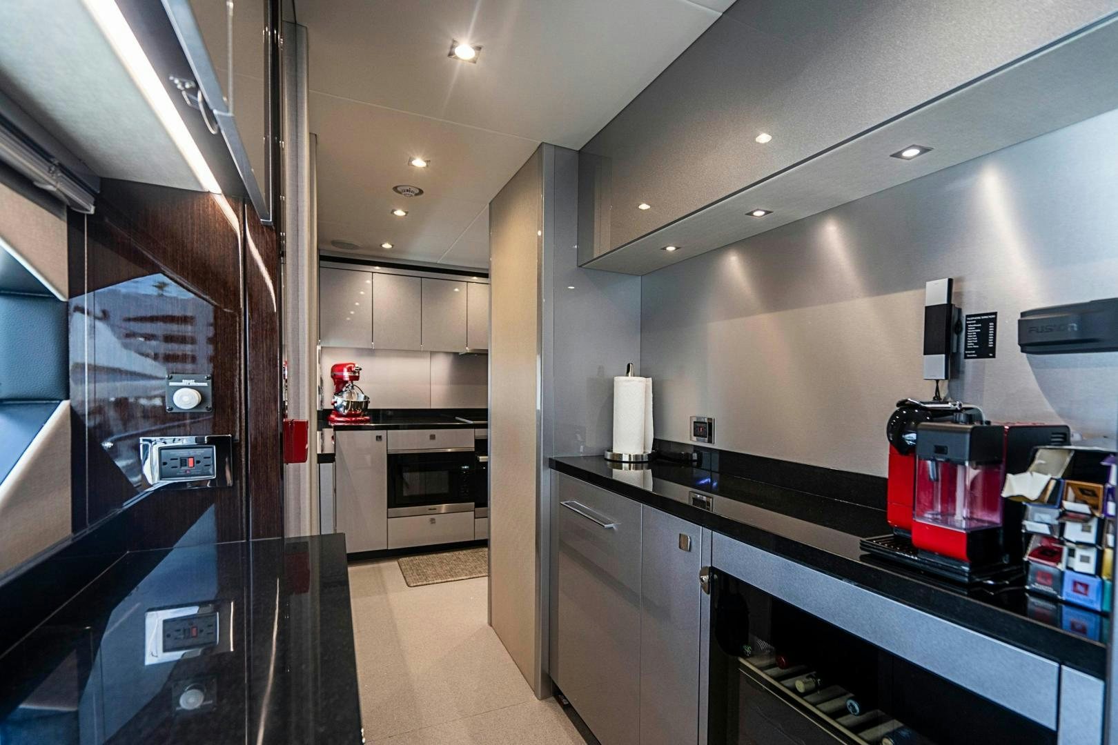 a kitchen with stainless steel appliances aboard QUANTUM Yacht for Sale