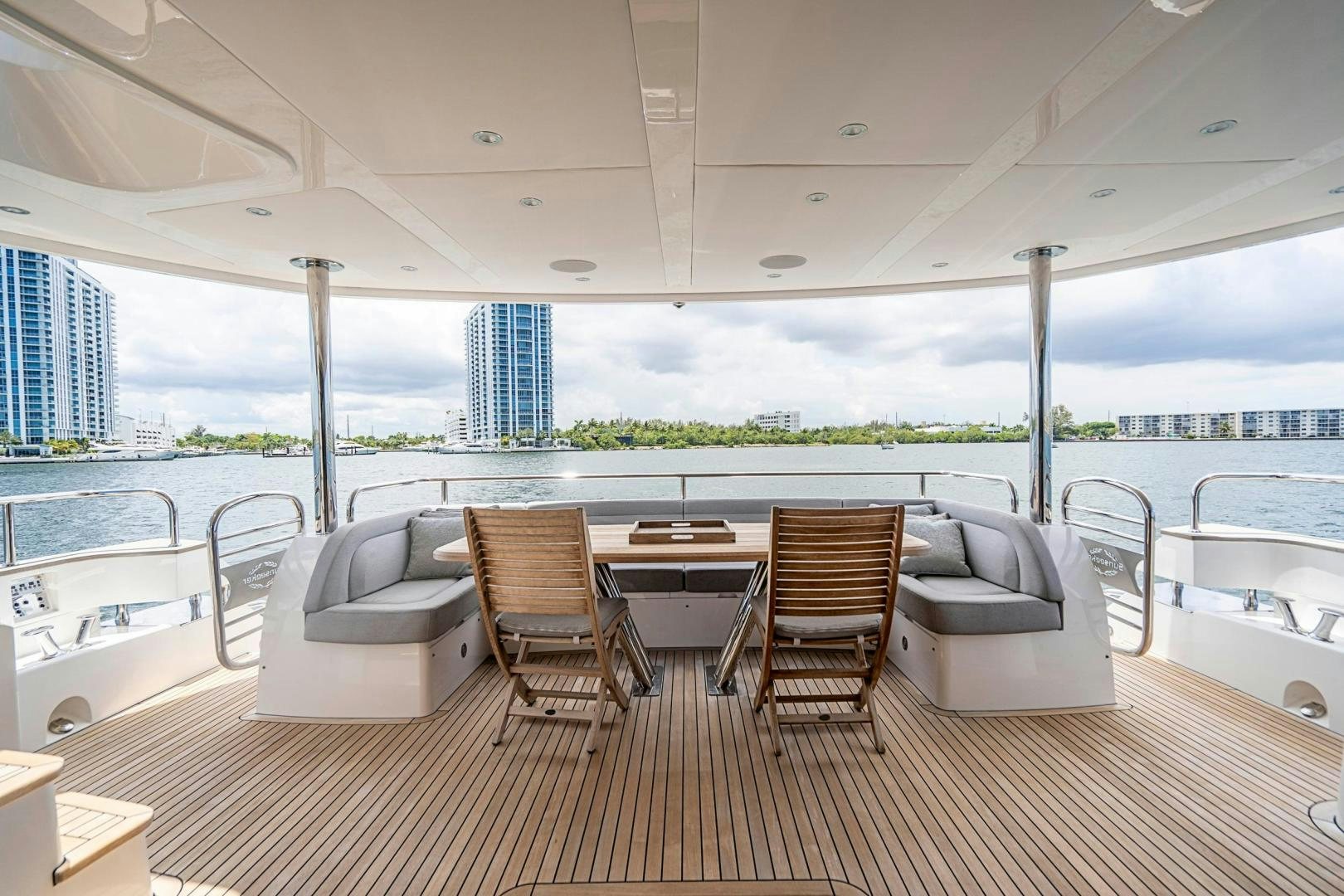 a large room with a table and chairs on a deck aboard QUANTUM Yacht for Sale