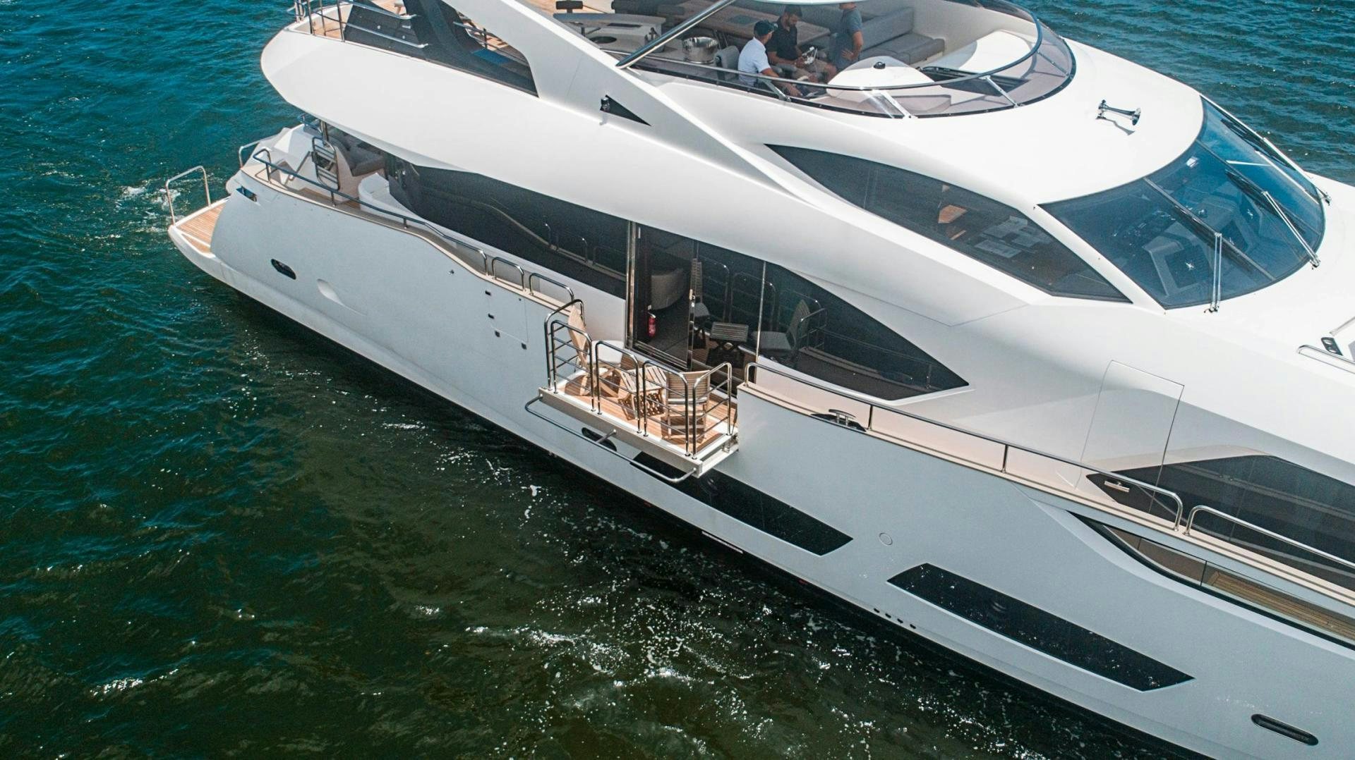 a white boat on the water aboard QUANTUM Yacht for Sale