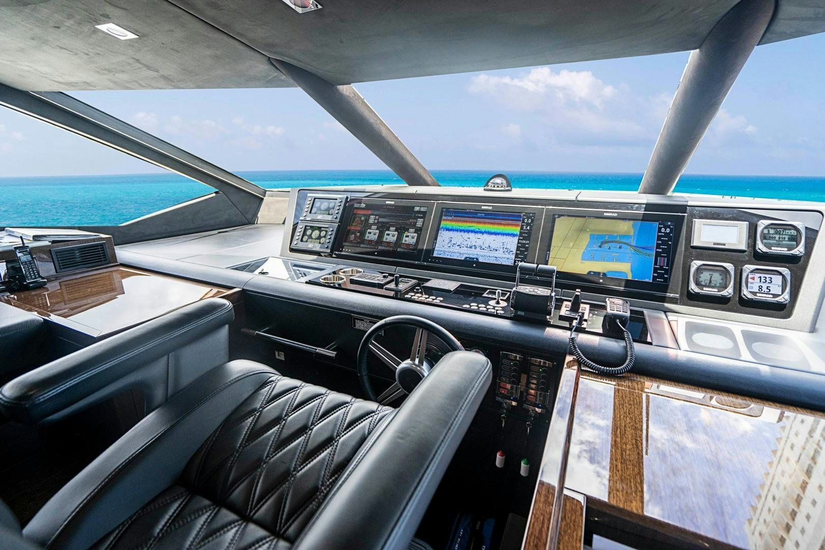 inside of a car aboard QUANTUM Yacht for Sale