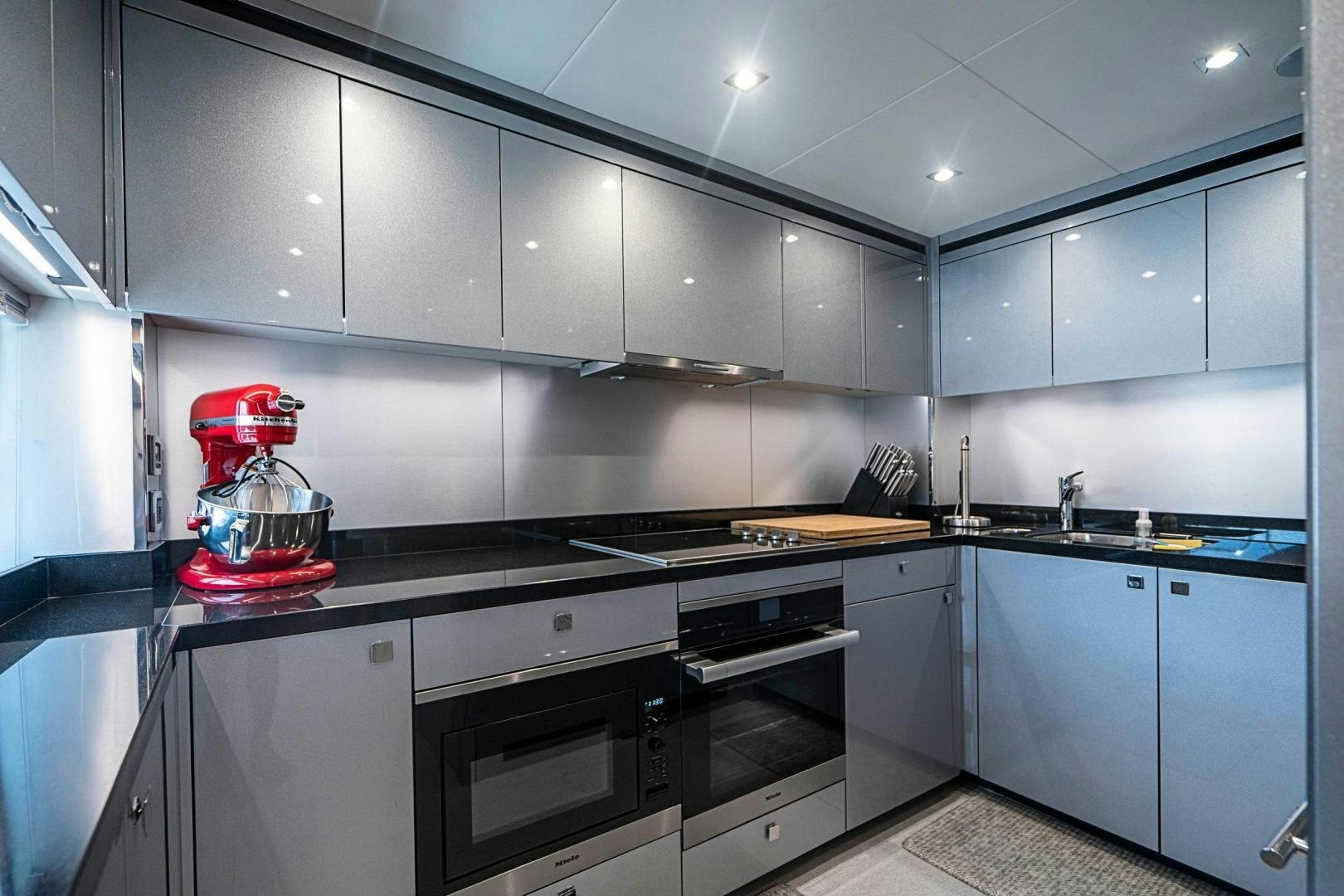 a kitchen with a stove and oven aboard QUANTUM Yacht for Sale
