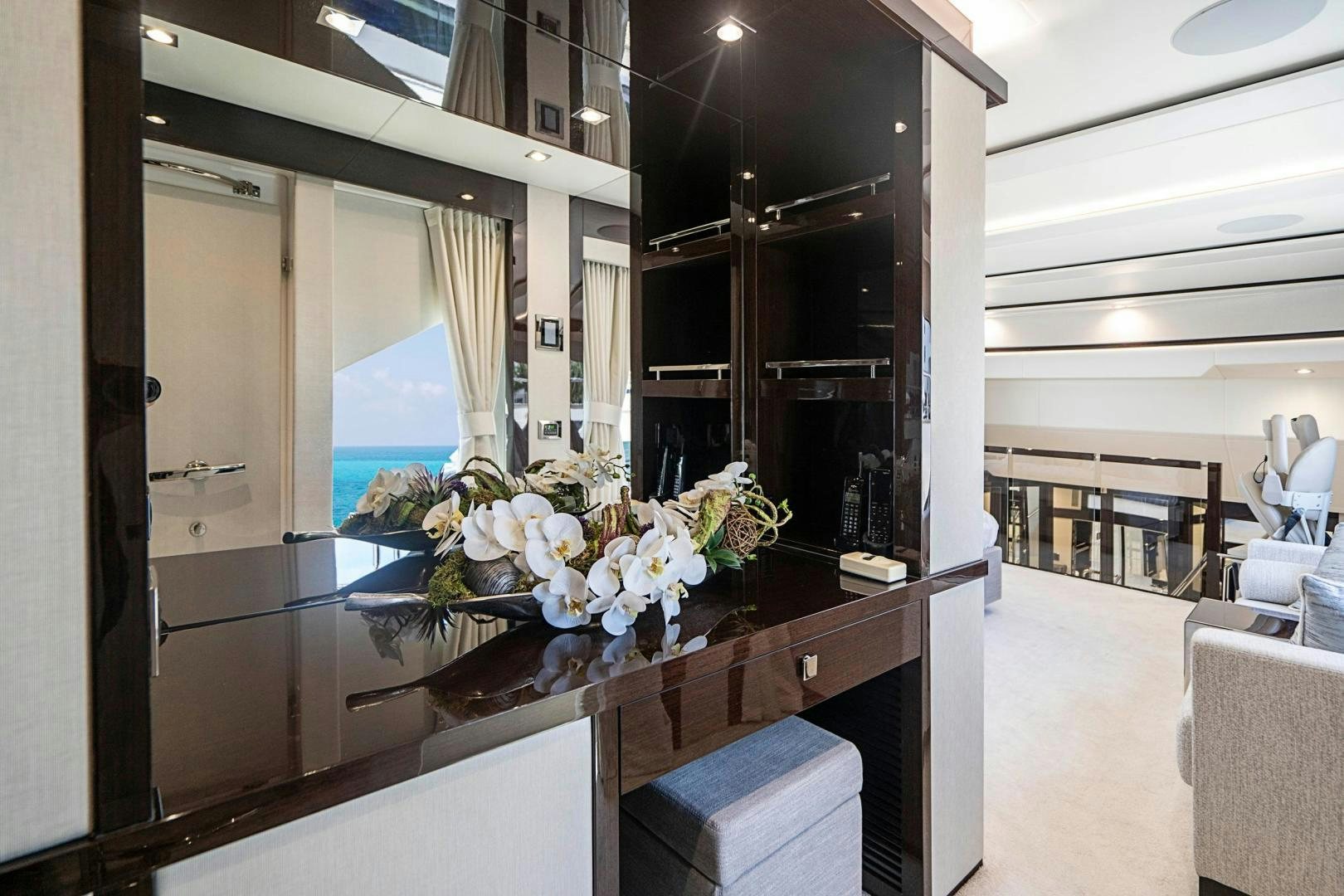 a room with a counter and chairs aboard QUANTUM Yacht for Sale