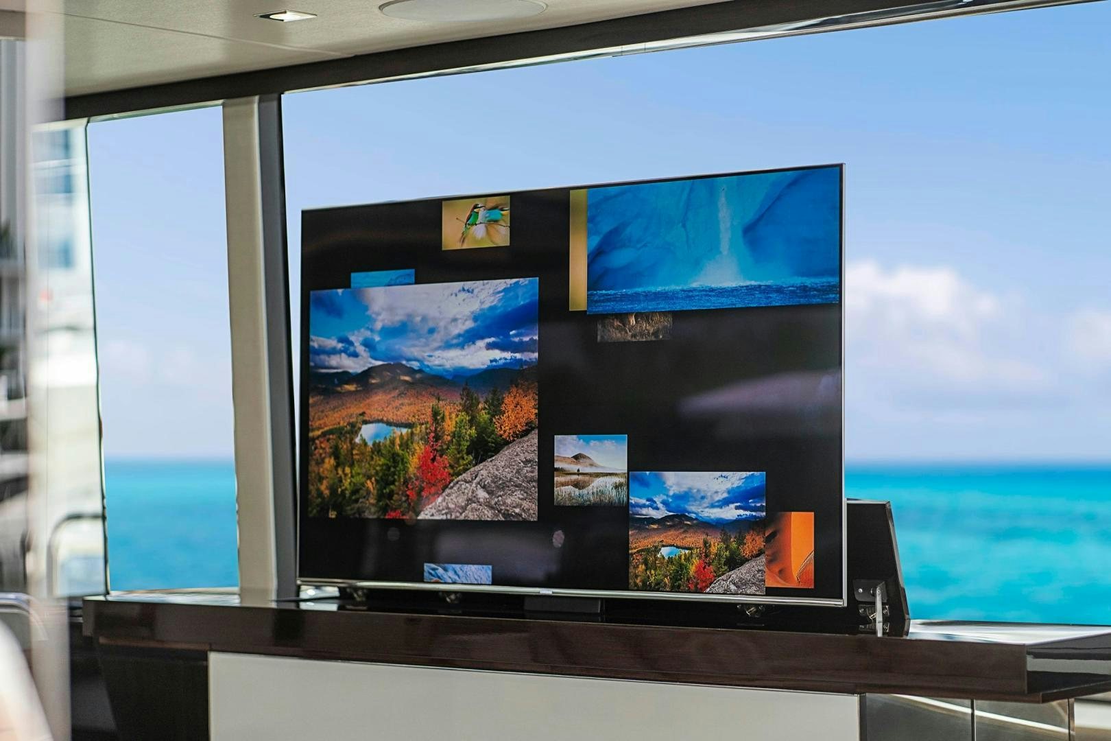 a large screen on a table aboard QUANTUM Yacht for Sale