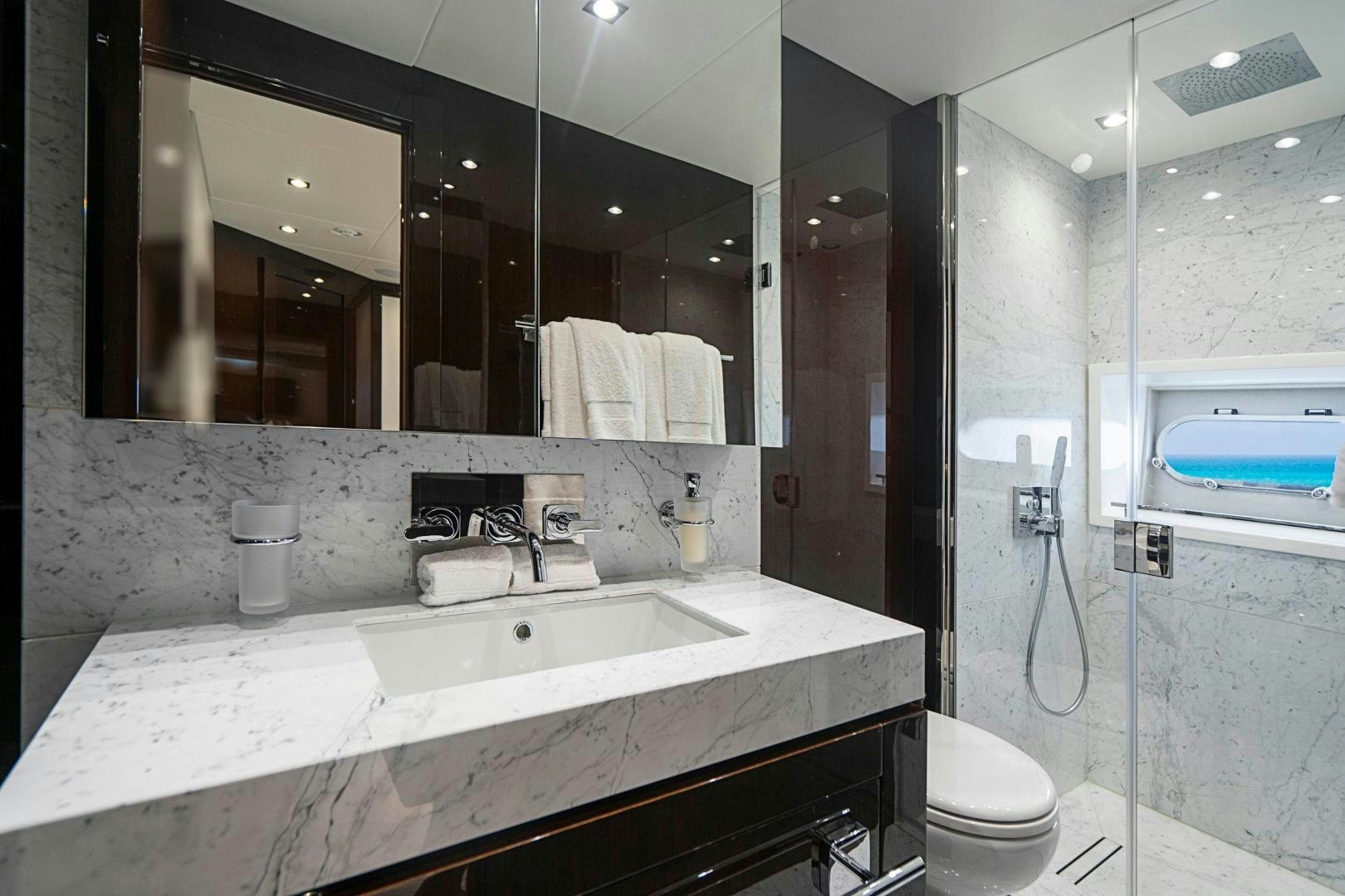 a bathroom with a sink and a mirror aboard QUANTUM Yacht for Sale