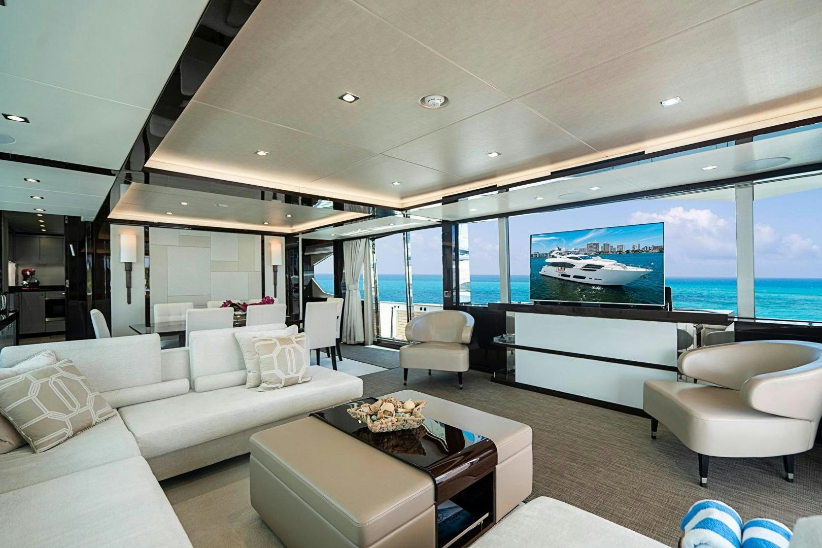 a living room with a large screen aboard QUANTUM Yacht for Sale