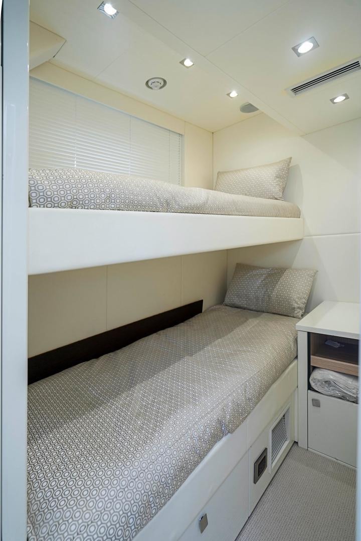 a bed with white sheets aboard QUANTUM Yacht for Sale