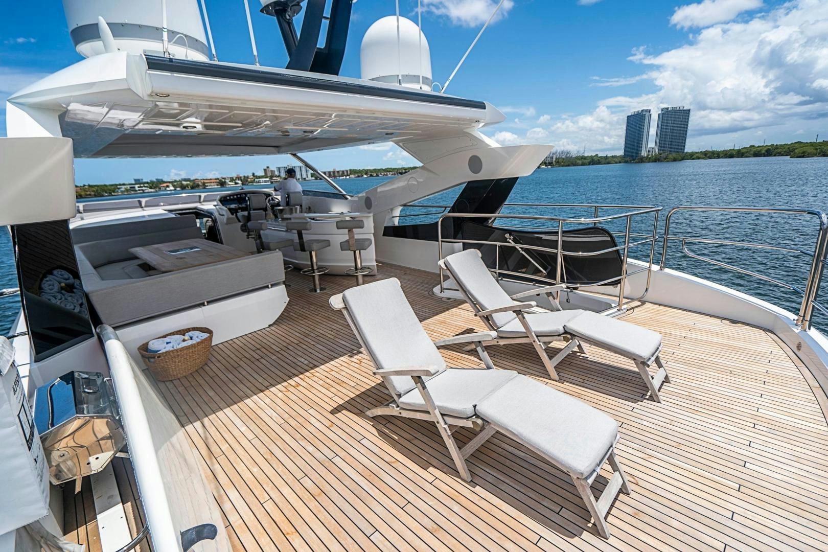 a deck with a view of a city and a body of water aboard QUANTUM Yacht for Sale