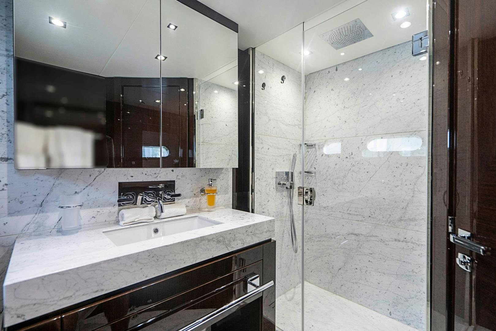 a bathroom with a large mirror aboard QUANTUM Yacht for Sale