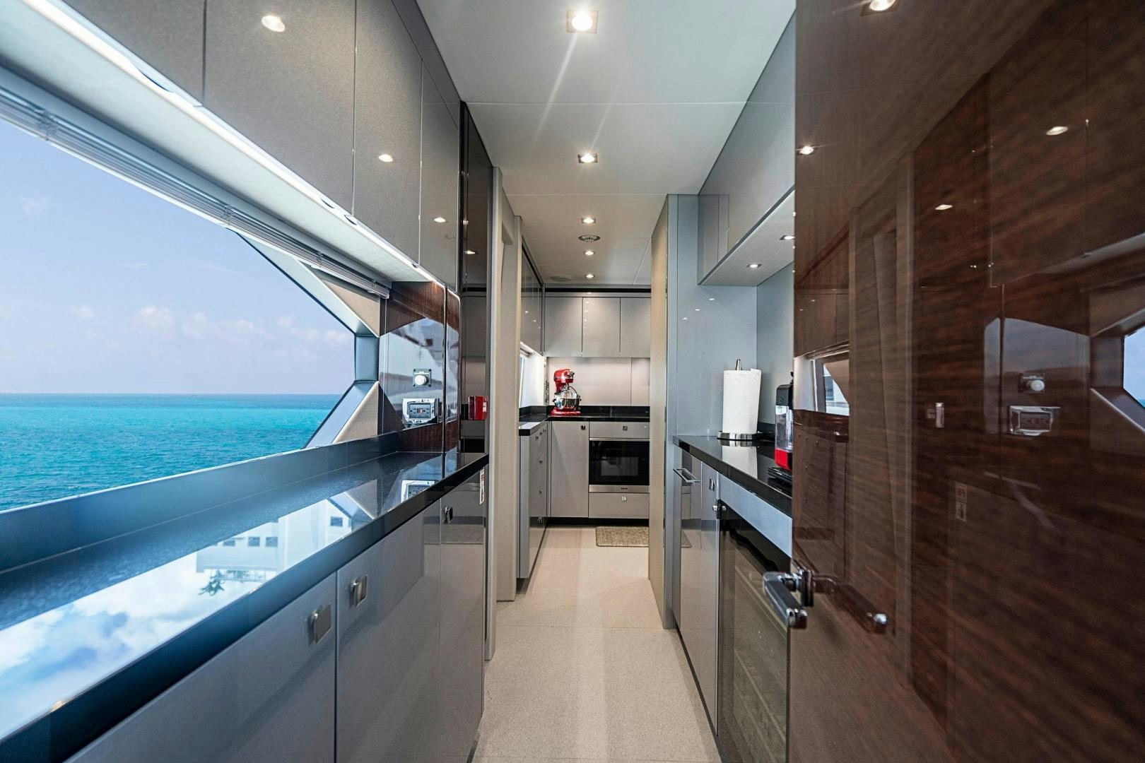 a room with a large glass door aboard QUANTUM Yacht for Sale